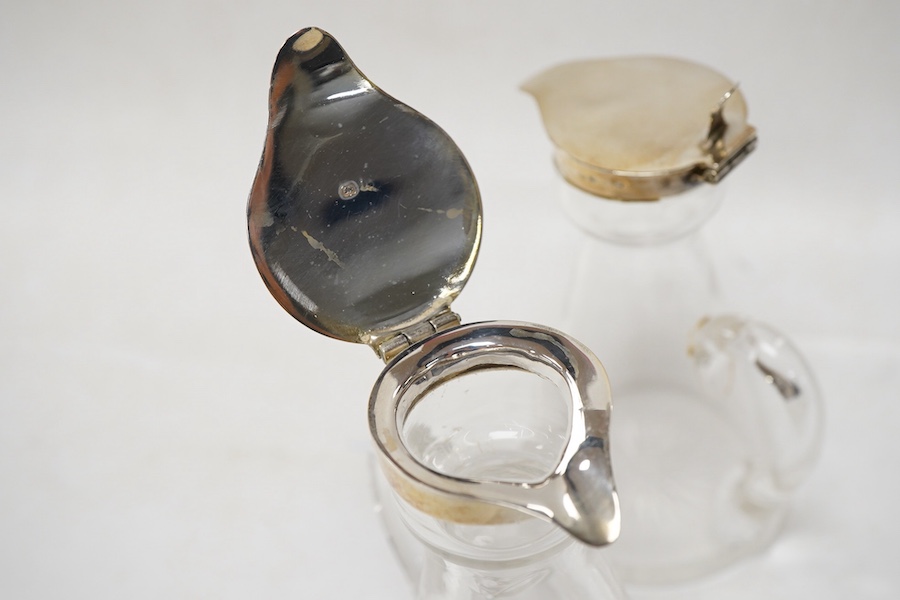 A pair of George V silver mounted glass whisky noggins, by S. Blanckensee & Sons Ltd, Birmingham, 1916, height 11cm.